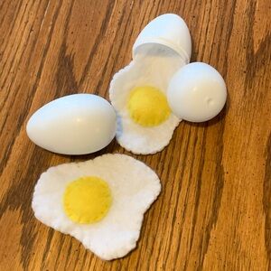 Handmade felt eggs inside plastic shell that opens